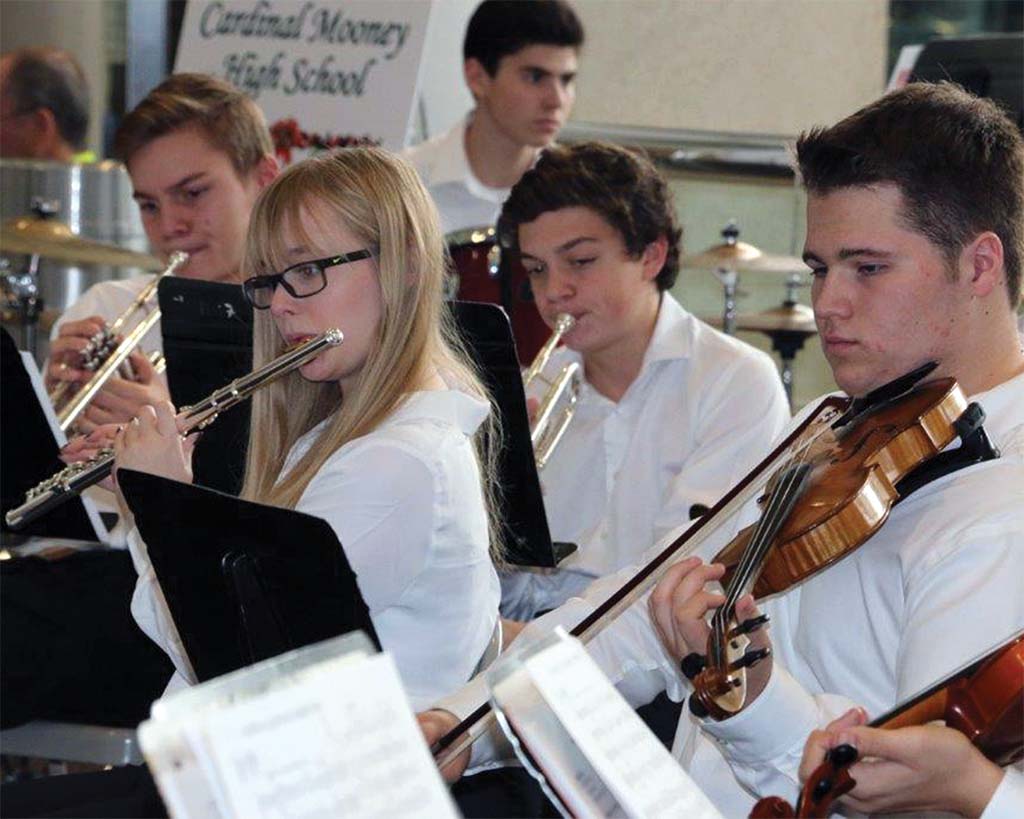 Carousel of students performing music