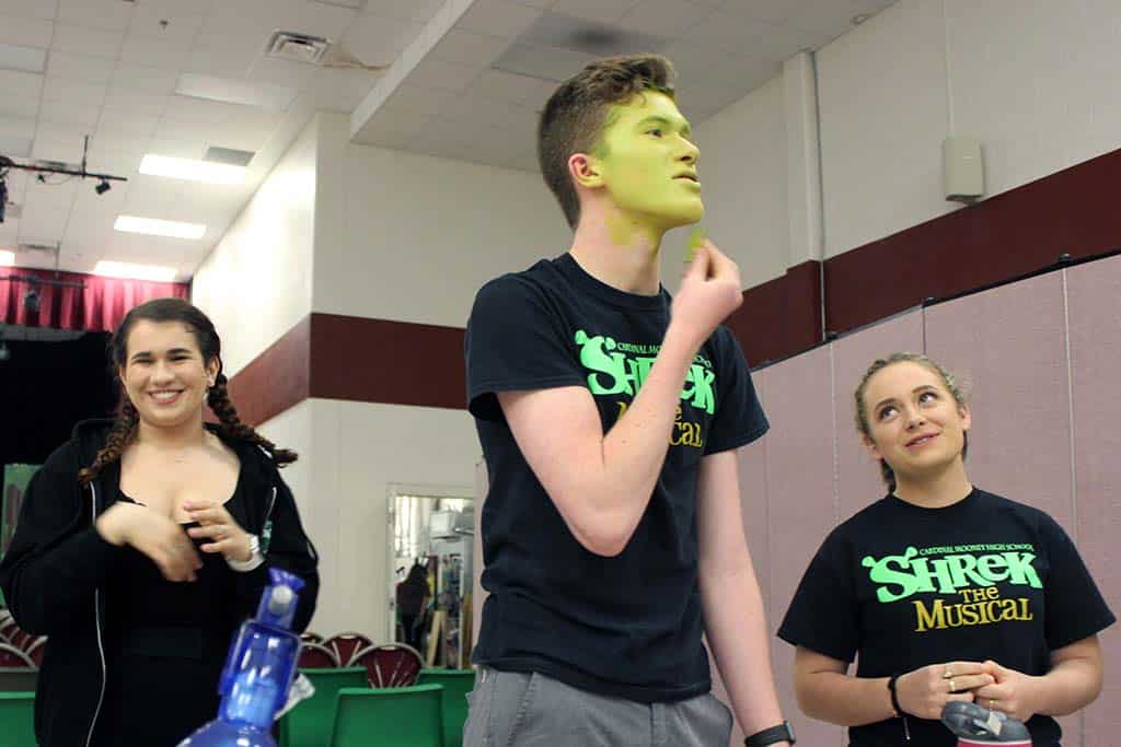 Drama kids putting on makeup for Shrek