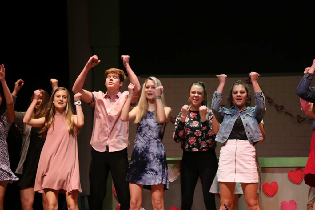 Theater students dancing on stage